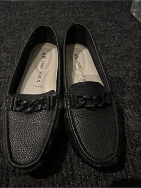 Anne Klein Black Pebbled Leather Chain-Trim Slip-Ons